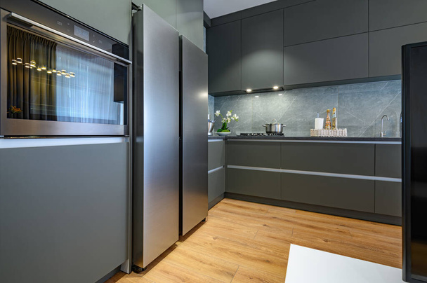 Modern large luxury dark gray kitchen - Photo, Image