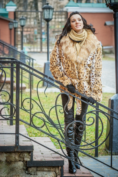 smiling beautiful woman in a brown coat - Photo, Image