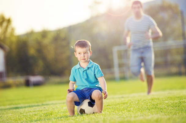 Father with son playing football - Fotoğraf, Görsel