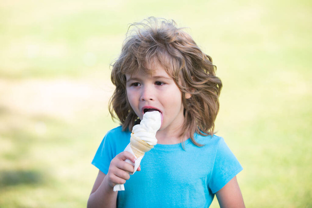 Funny child eating icecream, face close up. Kids head portrait. - Фото, зображення