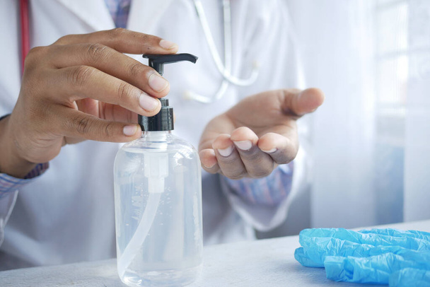 close up of doctor hand using sanitizer gel  - Valokuva, kuva