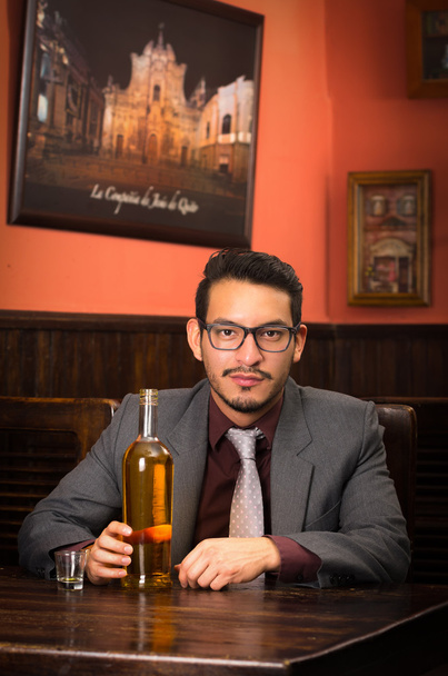 man in suit with bottle and alcohol shot - Photo, Image