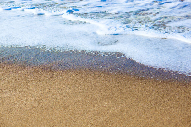 Blue sea water and yellow sand. Summer beach and holiday . Sea background - Φωτογραφία, εικόνα
