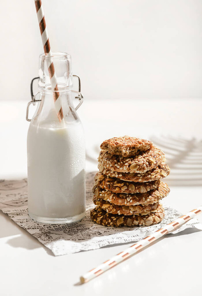 oatmeal cookies with a bottle of milk. High quality photo - Photo, Image