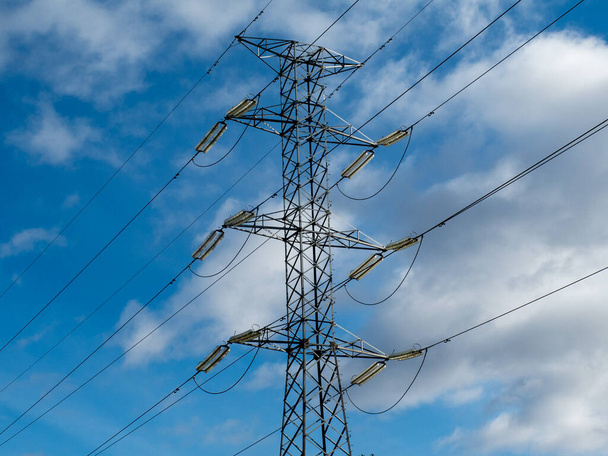 electric tower on a clear day with blue sky - Photo, Image
