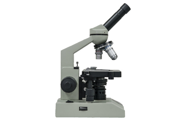 Vista laterale di un microscopio isolato su bianco con percorso di ritaglio
 - Foto, immagini