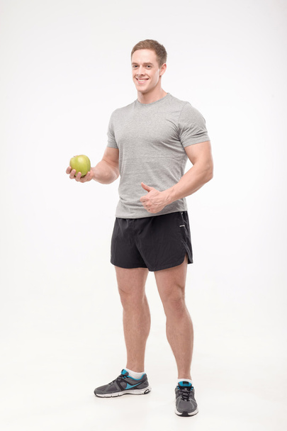 Athlete with an apple - Foto, immagini