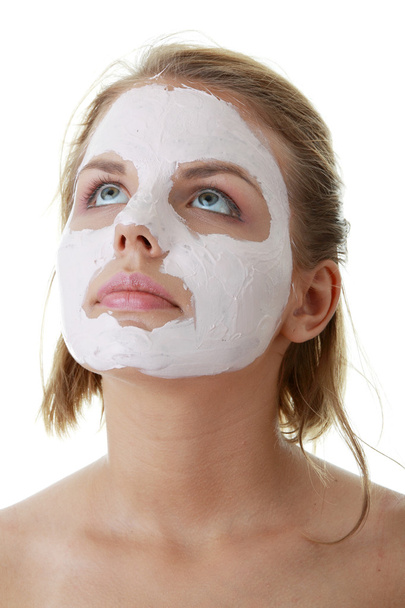 Young female face with clay mask - Фото, изображение