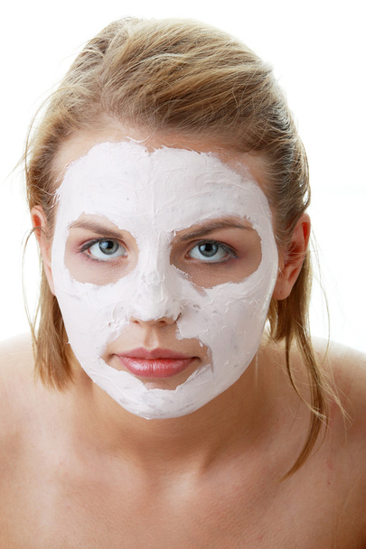 Young female face with clay mask - Foto, immagini
