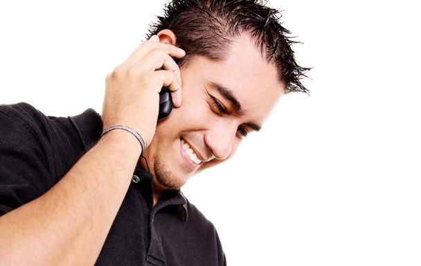 Giovane uomo che parla per telefono su sfondo hiwte
 - Foto, immagini