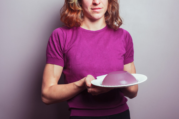 Young woman with pudding - Фото, изображение
