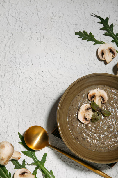 porridge with mushrooms and arugula on wooden board - Photo, Image