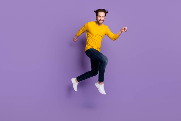 Full length body size photo smiling man jumping up running fast isolated pastel purple color background - Photo, Image