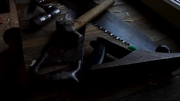 Sliding in slow motion above workbench with vintage tools in workshop - Footage, Video