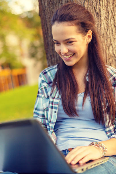 smiling teenager with laptop - Fotoğraf, Görsel