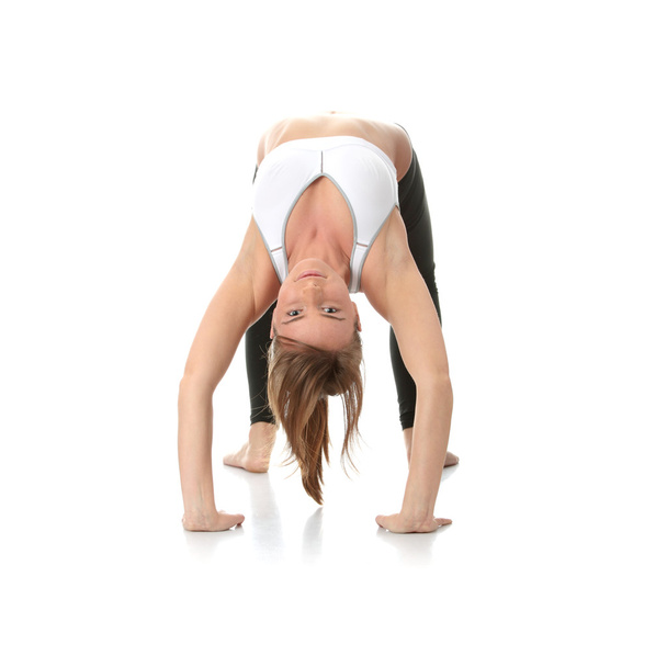 Beautiful young woman doing yoga exercise , isolated - Foto, Imagen
