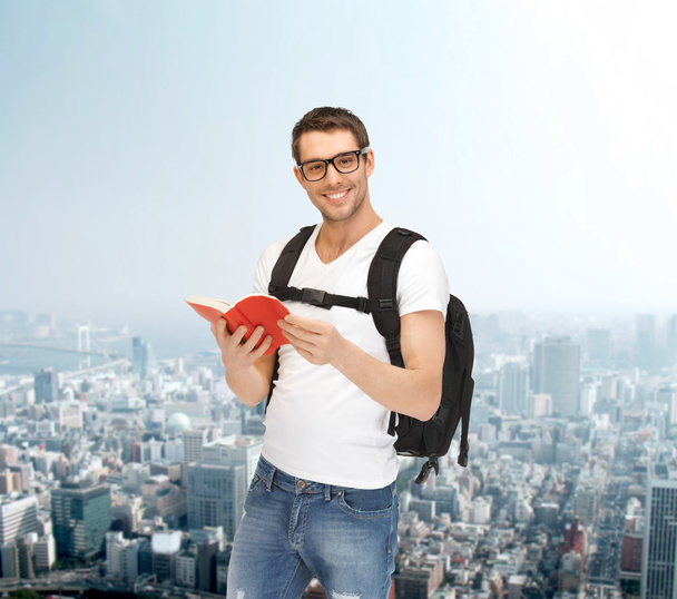 travelling student with backpack and book - Zdjęcie, obraz