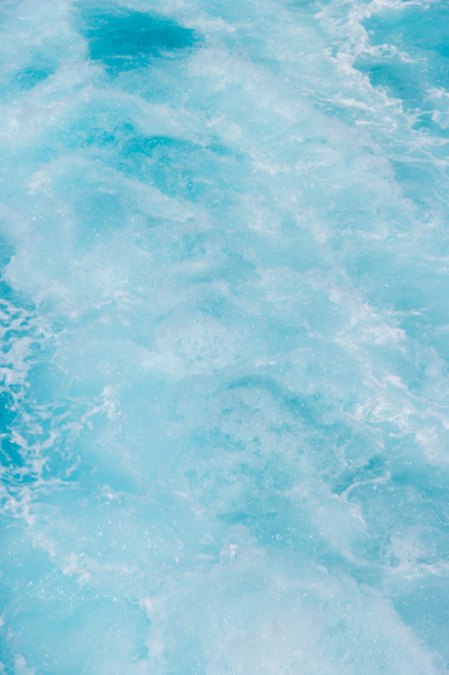 Wake in blue clear waters - Фото, изображение