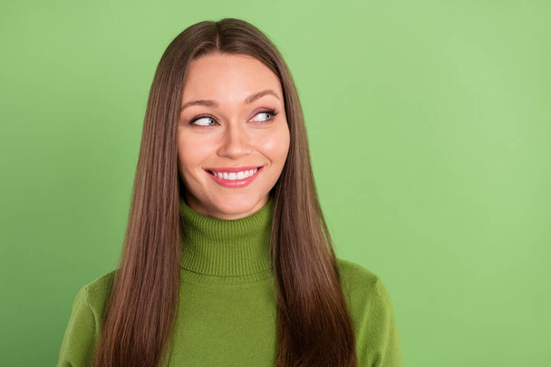 Photo of happy nice dreamy cheerful woman look empty space smile face isolated on green color background - Foto, imagen
