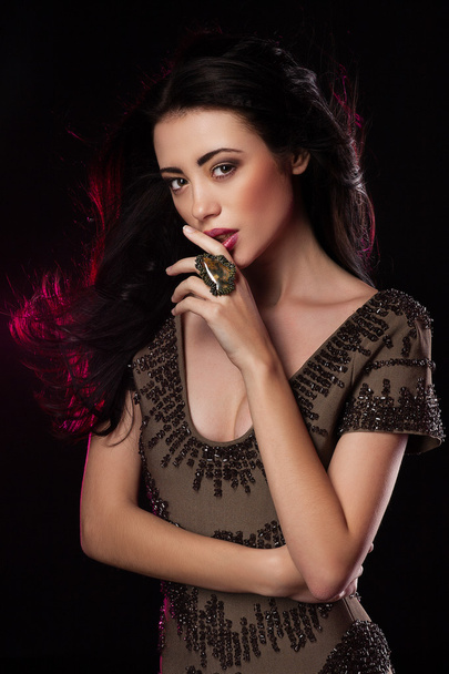 Fashion studio shot of beautiful woman with makeup and hairstyle wearing evening dress - Foto, immagini