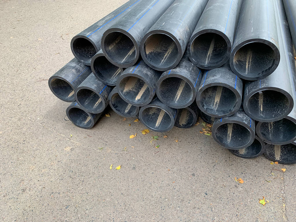 HDPE water supply pipes for construction in the city, repair process of urban water supply systems. HDPE is high density polyethylene. - Fotoğraf, Görsel