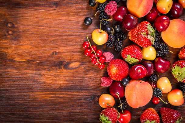 fresh berries on wooden table - Photo, Image