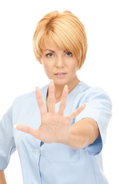 Attractive female doctor showing stop gesture - Foto, Imagen