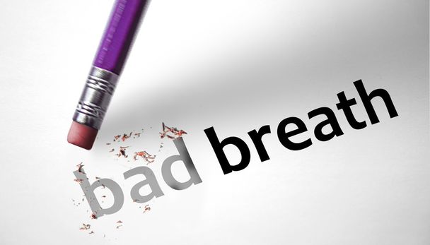 Eraser deleting the words Bad Breath  - Photo, Image