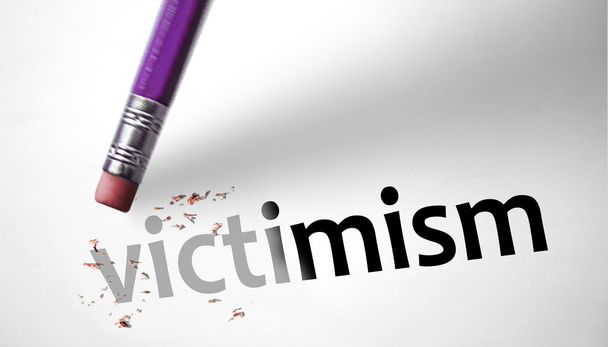 Eraser deleting the word Victimism  - Photo, Image