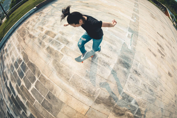 Skateboarder skateboarding outdoors in the morning - Фото, изображение