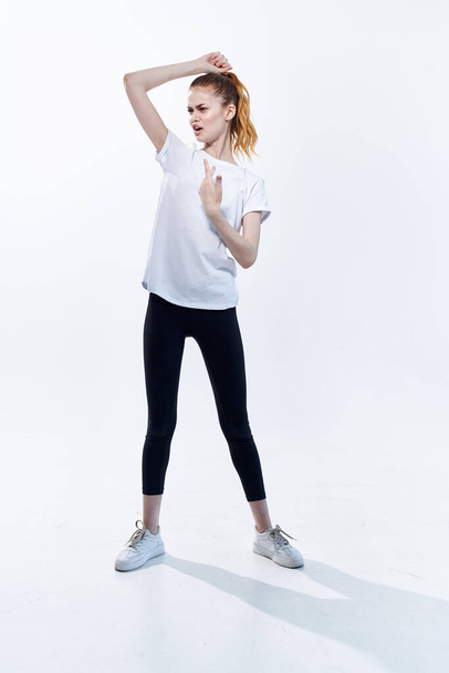 woman in sports uniform workout posing fitness light background - Фото, изображение