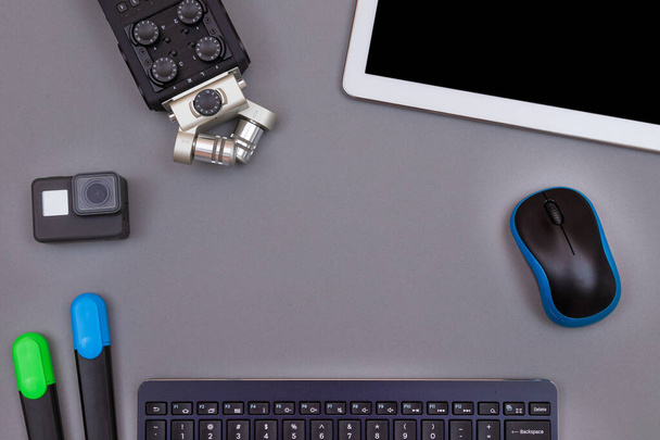 Digital Gadgets on Grey Table - Video Bloggers Workplace - Foto, Imagen