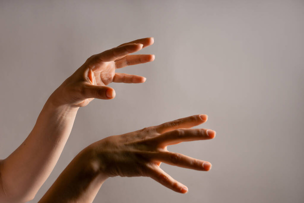 Elegant female hand, pointing to the side. palm hung down. Hand gestures - Φωτογραφία, εικόνα