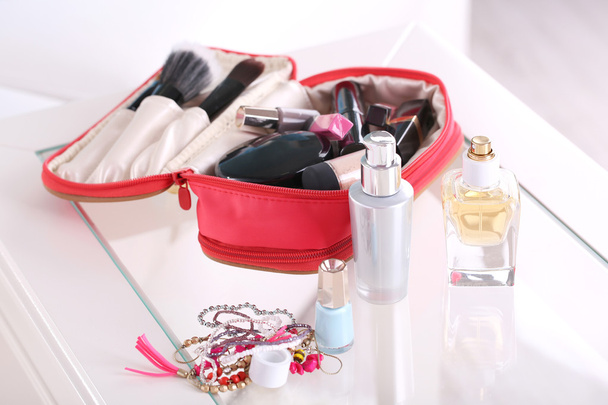 Cosmetic bag on table - Фото, зображення