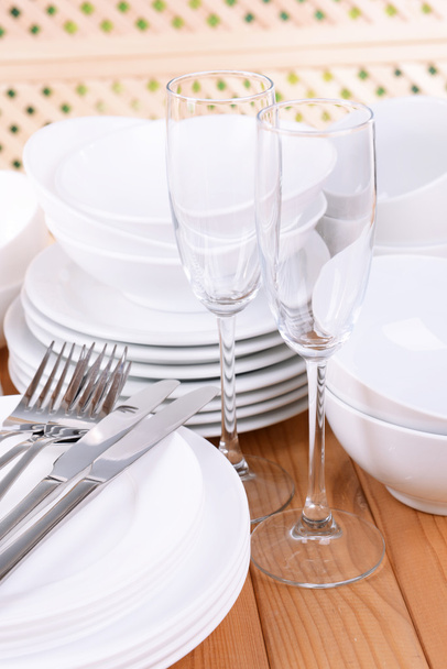 Set of white dishes on table - Foto, imagen