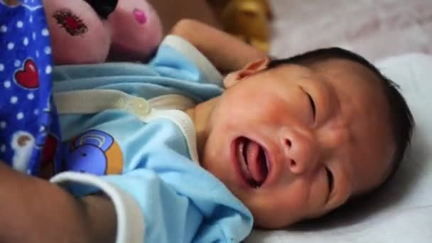 Newborn infant cry at bed. Parenthood, love, family concept - Footage, Video