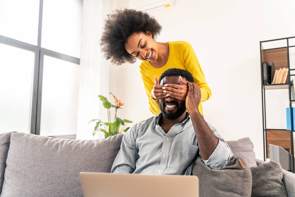 Beautiful afro-american couple working on computer laptop device - Modern couple shopping online - Photo, Image