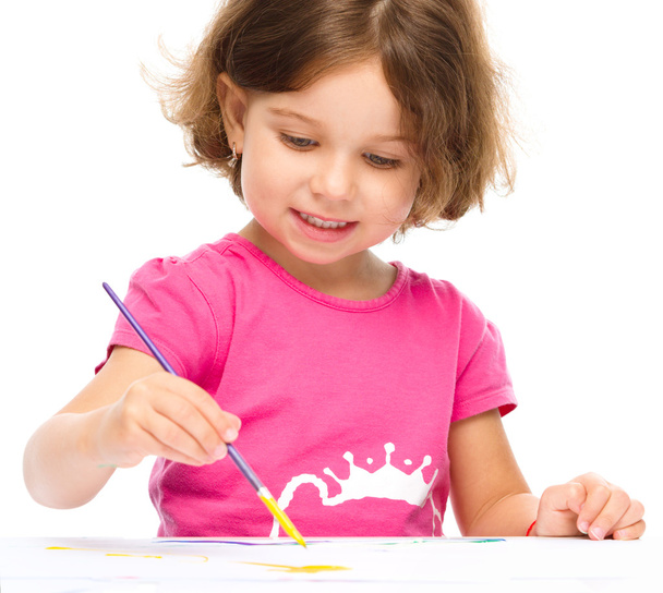 Little girl is painting with gouache - Photo, Image