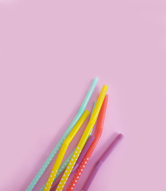 tubes multicolored on a colored background - Foto, imagen