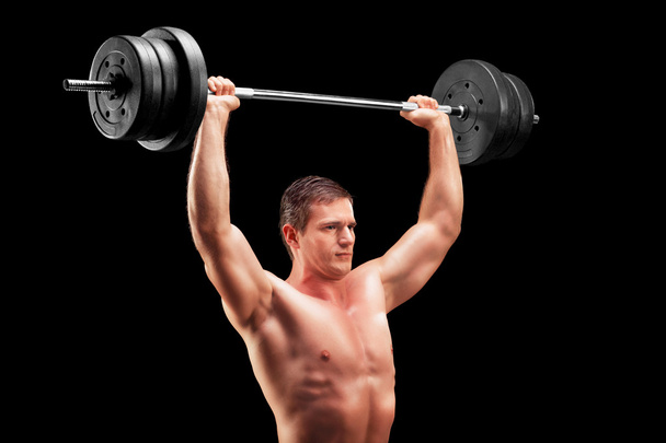 Bodybuilder lifting heavy weight - Fotó, kép