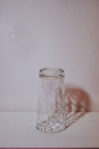 A glass jar and its shadow on the wall - Foto, Imagem