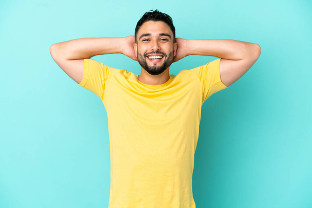 Young arab man isolated on blue background laughing - Φωτογραφία, εικόνα