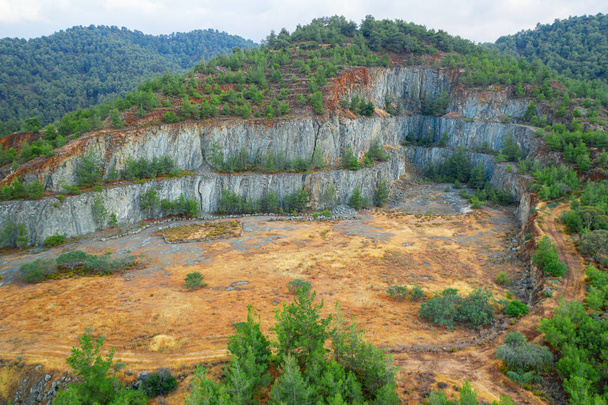 Reforestation of the terraced ground at the old mine in Troodos mountains near Kapedes, Cyprus. This area is rich with copper ore and sulfide deposits - Photo, Image