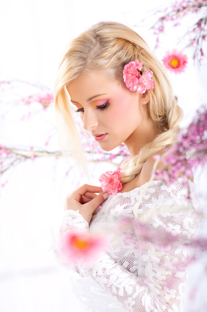 Portrait of a beautiful woman with blossoms, spring - Photo, Image