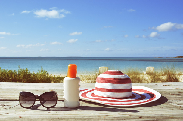 Sun lotion and sunglasses - Photo, Image