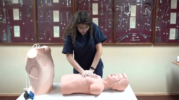 first aid help on mannequin, medical student, practice cpr, heart compressions - Footage, Video
