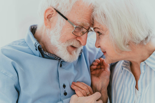 Senior couple together at home, happy moments - Elderly people taking care of each other, grandparents in love - concepts about elderly lifestyle and relationship - Φωτογραφία, εικόνα