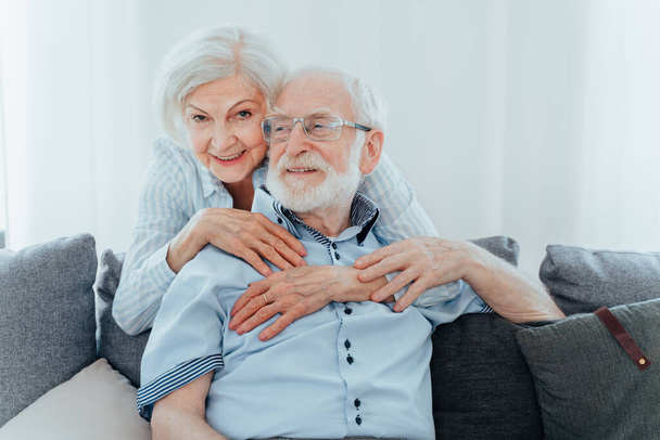 Senior couple together at home, happy moments - Elderly people taking care of each other, grandparents in love - concepts about elderly lifestyle and relationship - Фото, изображение