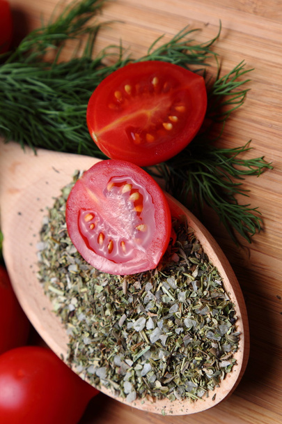 Ripe fresh tomatoes and herbs and spices for a correct and healthy diet - 写真・画像