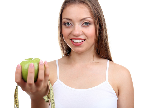 Beautiful girl with apple and measuring tape - Foto, Imagen